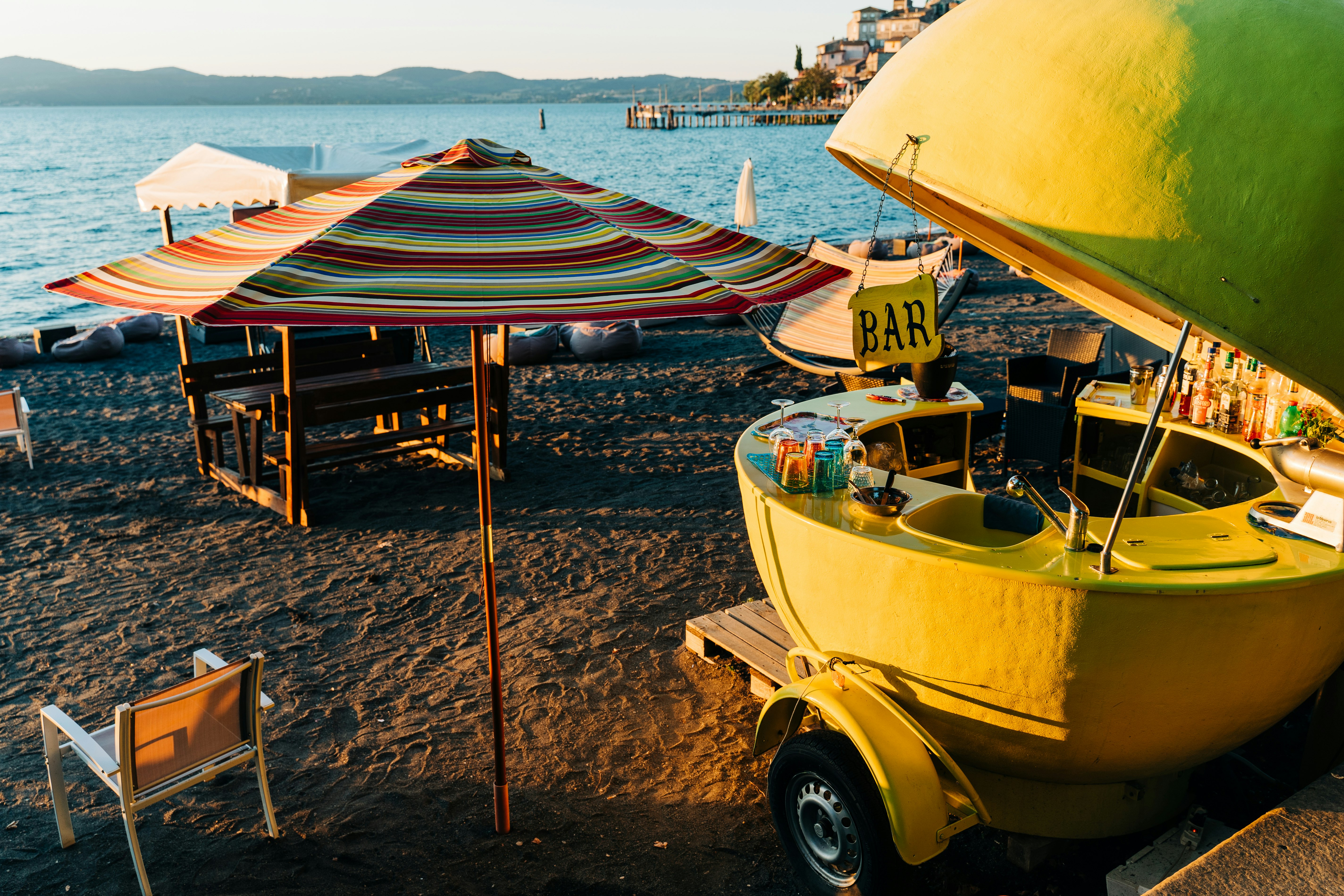 yellow and white boat on beach during daytime